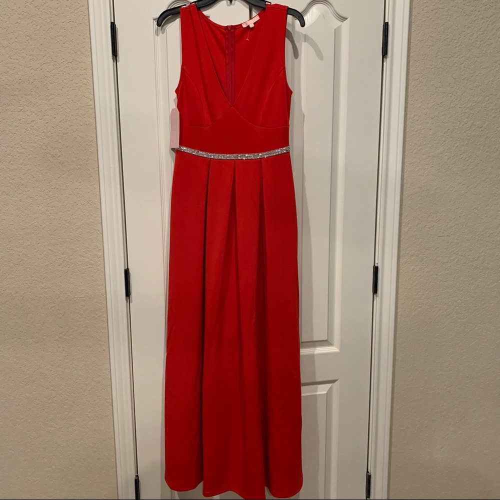 Red Gown with rhinestone trim at the waist size medium